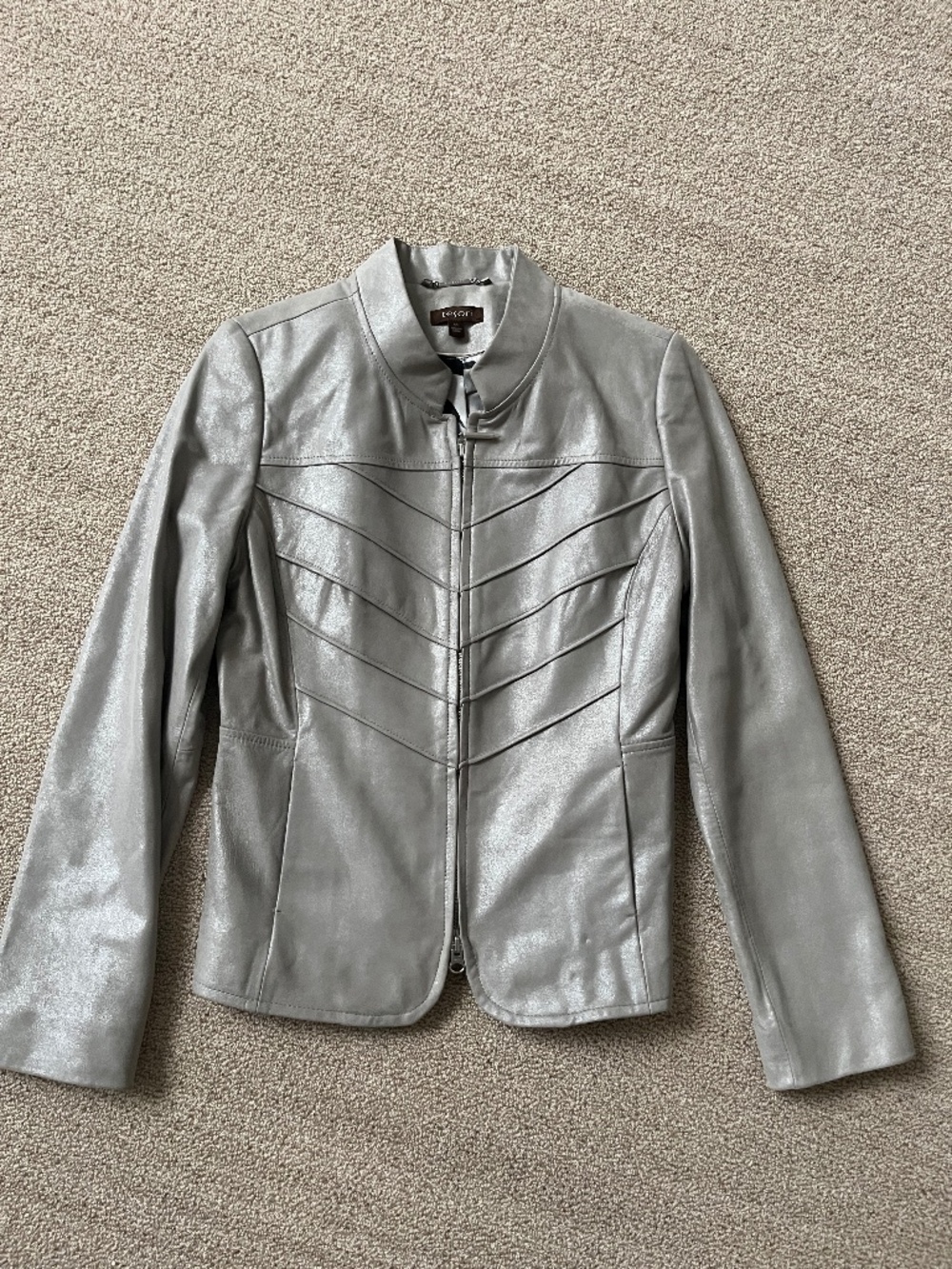 Gorgeous, silver leather jacket with stand collar and tucking detail. Tesori, xs